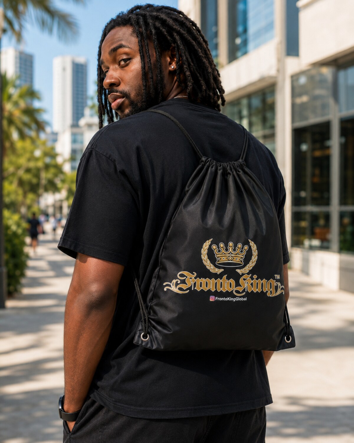 Model wearing a black Fronto King drawstring bag